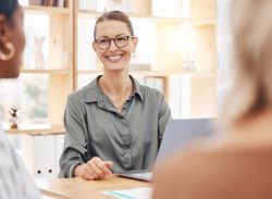 Woman leading meeting with clients