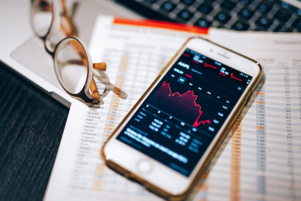 Stocks on phone with glasses
