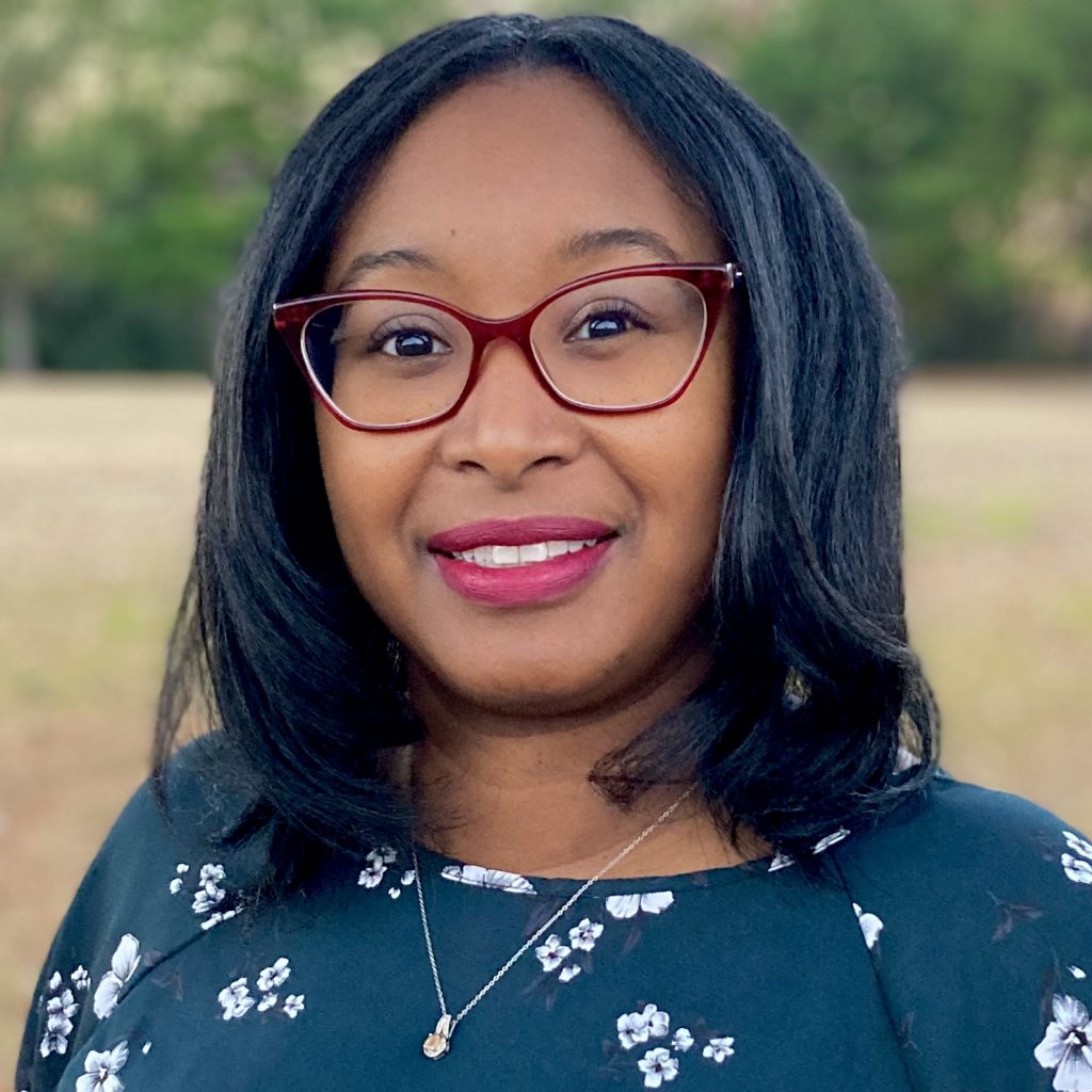 Tachelle Nettles smiling warmly.