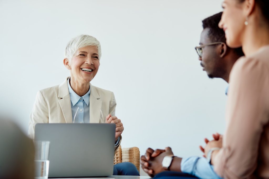 Happy mature accountant meeting with clients